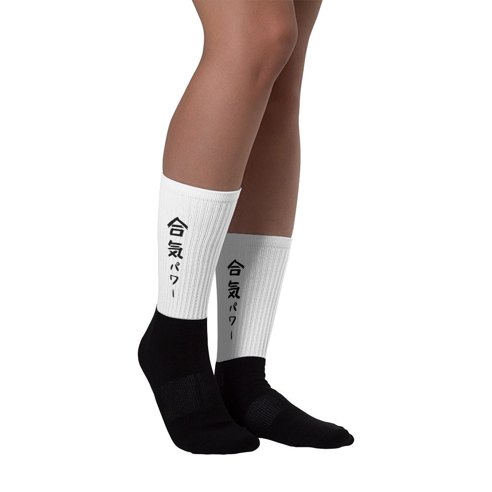 http://www.shinkikan.com/houston-aikido-martial-arts/aikido-houston-blog/wp-content/uploads/2021/03/black-foot-sublimated-socks-right-6063fdfe462fc.jpg